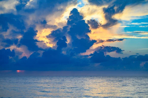 Sea beach with sky sunset or sunrise. Cloud over the sunset sea. Sunset at tropical beach. Nature sunset landscape of summer morning sea
