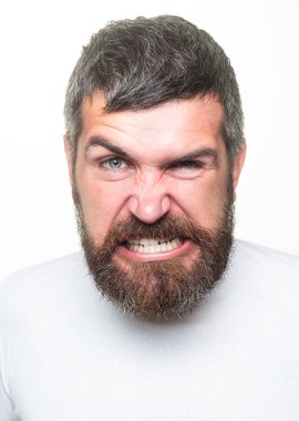Man with angry expression. Angry hateful guy furious. Angry rage man face. Anger man with furious negative emotion portrait. Aggressive and mad bearded man bad behavior in studio