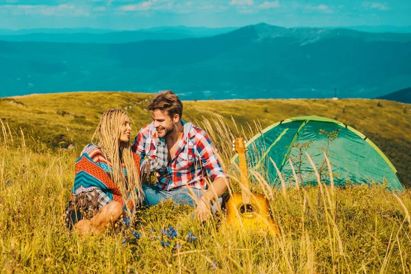 Romantic couple on camping. Outdoor adventure with friends on nature. Nature trips
