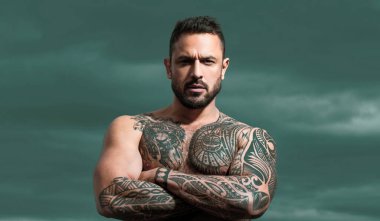 Confident attractive man with serious face. Naked male shoulders, topless athletic body