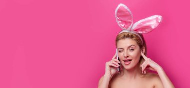 Funny Easter bunny woman calling with cell phone. Easter banner, mockup copy space, header for website, template