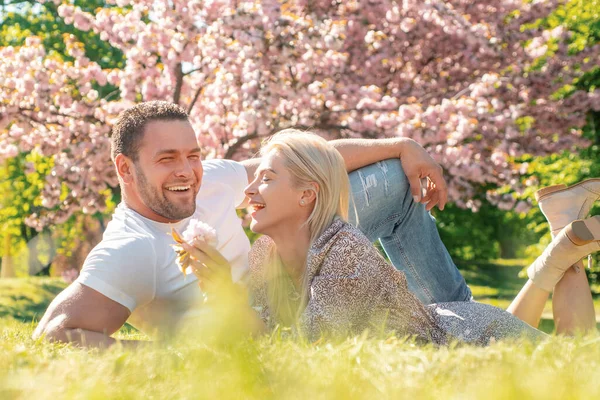 Spring romantic couple in love looking at each other. Smiling face of spring happy young couple. Valentines day concept