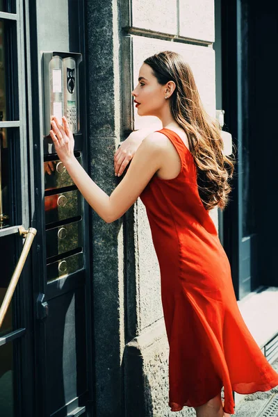 Young woman posing. Portrait of serious woman. Sensual model girl with smooth skin in a summer dress. Sensual woman. Full length portrait happy fashion woman walking in town