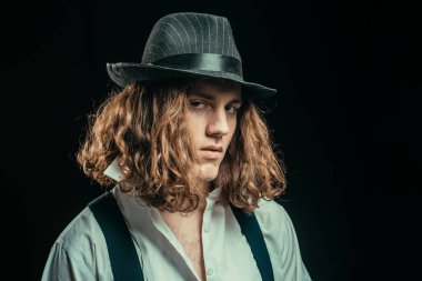 Portrait muscular man in hat. Handsome strong sporty perfect seductive confident man. Man portrait. Young serious man. Confident concept. Close up portrait of serious