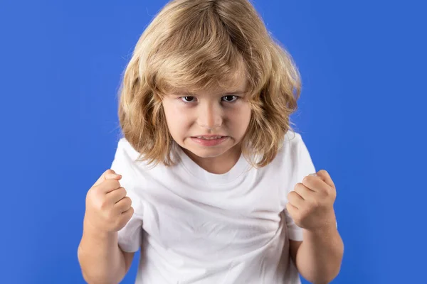 Child with angry expression. Angry hateful little boy, child furious. Angry rage kids face. Anger child with furious negative emotion portrait. Aggressive and mad kid bad behavior
