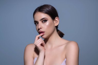 Beauty skin. Woman beauty face, clean fresh skin natural makeup, beauty eyes and lips of female photo model. Beautiful woman with fresh healthy skin, isolated on studio background. Beauty cosmetics