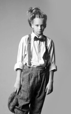 Expressing myself with fashion. jazz step fashion. teen girl in retro male suit. vintage english style. suspender and bow tie. old fashioned child. retro fashion model. vintage charleston party.