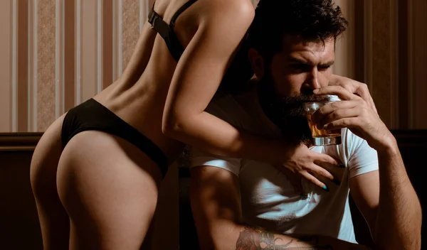 Bearded Brutal Alcoholic Man Drinking Alcohol Ignoring His Sexy Naked — 스톡 사진