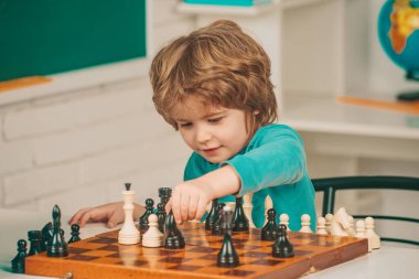 Happy Father and son. Education and learning people concept - pupil and Teacher. Chess success and winning