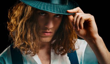 Young man tense face. Close up portrait handsome young man with serious expression on face. Man portrait. Isolated on black studio background