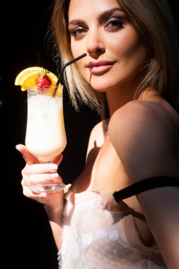 Sensual woman on weekend vacation drink cocktail. Pina colada alcoholic cocktail. Rest lifestyle concept