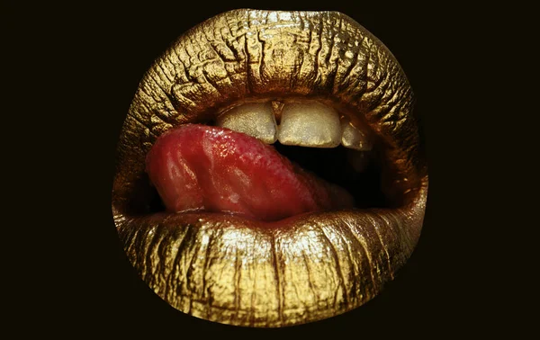 Gold lips, golden gloss lipstick. Cosmetics and make-up. Gold lips lipstick and gloss. Sexy and sensual lips. Golden lips closeup