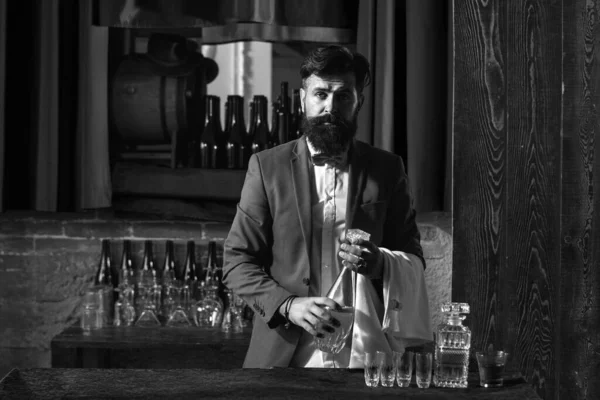 Waiter bartender in bar. Portrait of cheerful barman worker standing