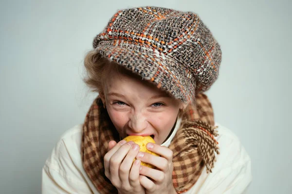old fashioned child in beret. retro fashion model. Vintage. street kid with dirty face. vintage english style. teen girl in retro male suit. Hungry and homelss. healthy food. help each other.