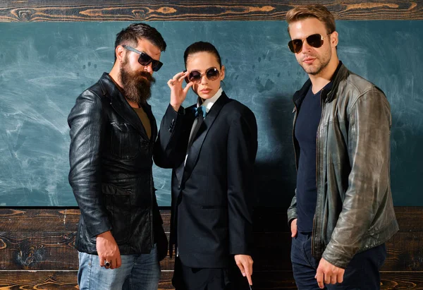 Woman and men wear masculine clothes and eyeglasses. Girl formal jacket suit and guys sunglasses copy space. Fashion trend. Stylish sunglasses accessory. Fashion outfit. People in sunglasses.