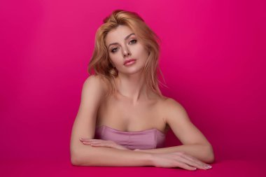 Fashion portrait of beautiful young model in studio. Fashionable woman with beauty face, soft skin, natural makeup, romantic look. Charming sexy sensual beautiful woman face close up