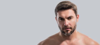 Beauty portrait of man with moisturizing cream on face, isolated background. Skincare routine. Male haircut, mustache and beard. Male beauty. Shaving, hair styling. Banner for header, copy space clipart