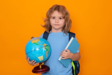 School kid with globe and book. Smart clever nerd. Caucasian blonde school boy kid pupil student going back to school. Education and knowledge