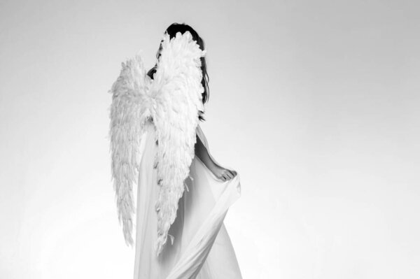 Angel girl. Long white wings. Wonderful blonde angel girl with white wings