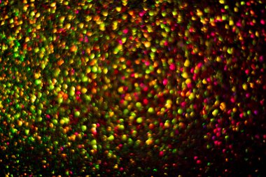 Bokeh 'in ışıldayan yıldızları arka planı kutlamak için kullanılıyor. Bokeh odaklı ışıkları olan soyut ışık arkaplanı. Sevgililer Günü, Parti, Noel geçmişi. Bulanık ışık. Parıldayan ışıklar