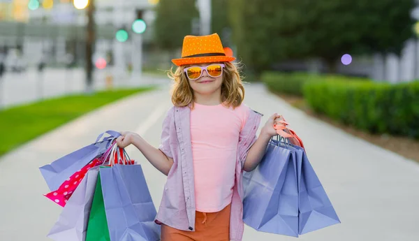 stock image Shopping bag. Funny fashion child model. Child on shopping. Portrait of a kid with shopping bags. Shopping boy