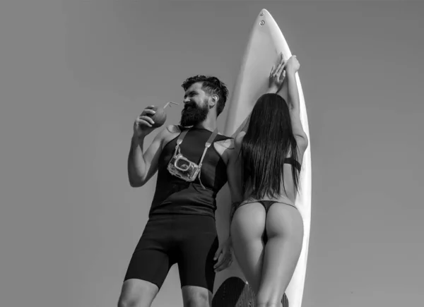 stock image Happy surfer couple with surfboard having fun on the beach. Sporty sexy people. Surfing sport and youth relationship lifestyle concept. Summer holiday. Young sexy couple in a summer day