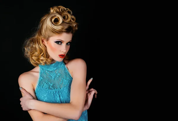 Serious young woman. Beautiful young woman with pin-up make-up and hairstyle. Beautiful young american girl in retro style, pinup
