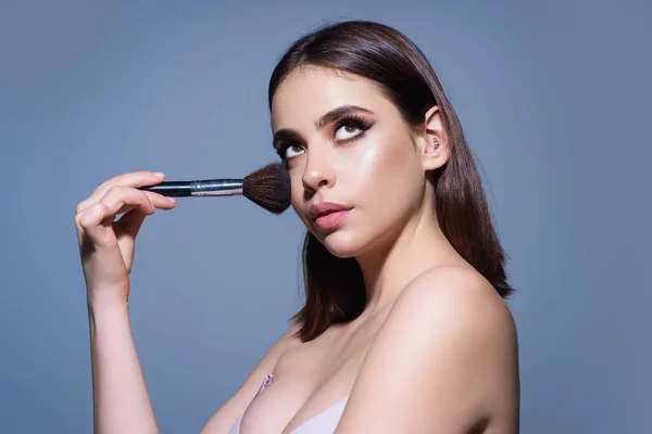 Beautiful Young Woman Applying Makeup Studio Background Pretty Girl Holding — Zdjęcie stockowe