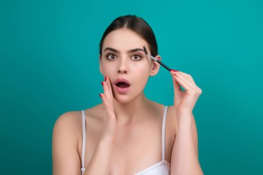 Mascara eyebrows. Natural beauty brows. Eyebrows coloring and lamination. Woman combing eyebrows. Makeup and cosmetology concept. Eyebrow shape modeling