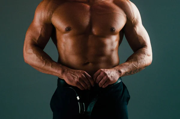 Man body torso. Muscular male torso isolated on gray