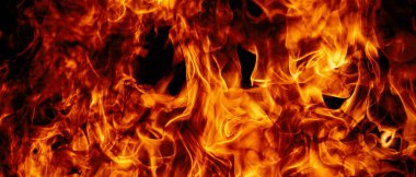 Siyah arka planda ateş dokusu. Soyut yangın arka planı, büyük yanan ateş