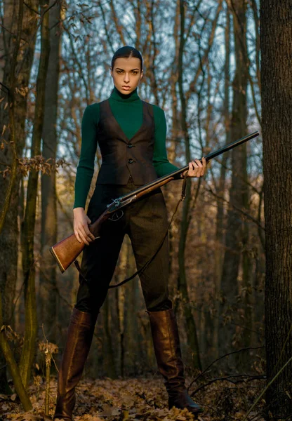 successful hunt. hunting sport. girl with rifle. chase hunting. Gun shop. military fashion. achievements of goals. woman with weapon. Target shot. hunter in forest. Hunter in fall hunting season.
