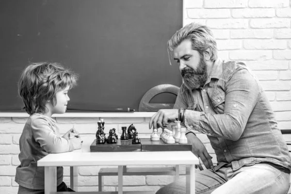 stock image Father teaching his son to play chess. Chess strategy. Chess success and winning. Education and people concept. Happy Fathers day