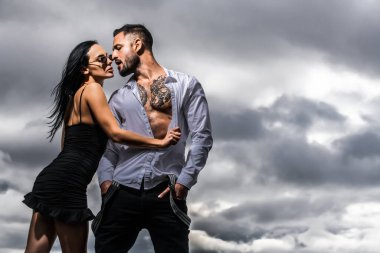 Lovely beautiful couple. Sexy woman and man. Sensual couple hugging, passion and sensual. Seduction flirt of romantic couple. Sexy moments. Romantic attractive sensual couple in love hugging