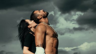 Passion love couple. Romantic moment. Handsome muscular guy and amazing sexy woman. Cosmopolitan couple. Love and flirt clipart