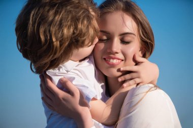 Mothers love. Closeup portrait of mother and child kissing. Mother hugging and embracing son. Mothers day, love family. Mother and child with tenderness. Mothers kiss child, cuddle warm relationships