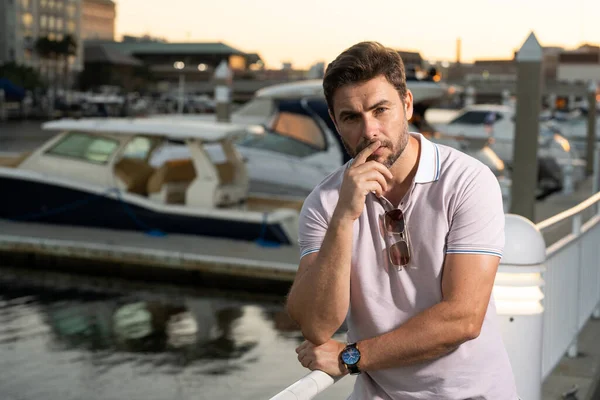 stock image Portrait of handsome confident man in city. Portrait of confident man in modern big american city. Stylish lambersexual model. Sexy man dressed in polo. Fashion male posing on street in Tampa