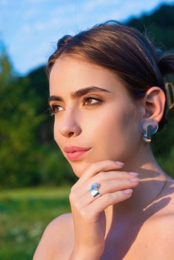 Romantic young woman posing near summer greenery outdoor. Country style. Sensual girl at countryside. Summer freedom lifestyle. Country hippie girl