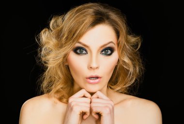 Shocked face of surprised young woman. Funny female shocked face expression. Portrait of excited woman spreading hands