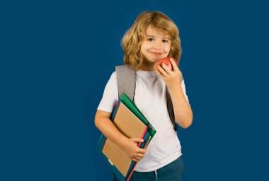 Learning knowledge and kids education concept. School teen boy in with backpack. Portrait of happy smiling school kid. Positive emotions