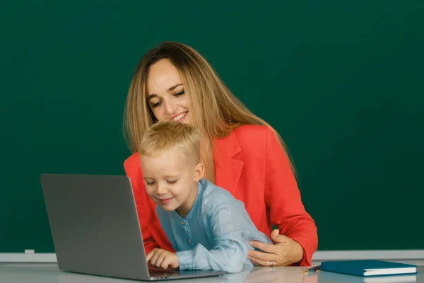Mother Son Learning Online School Teacher Helping School Child Online — стоковое фото
