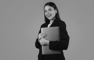 Charming positive lady hold laptop, isolated background. Young secretary