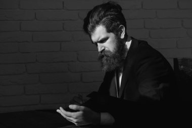 Portrait of a teacher or professor at classroom. Satisfied serious mature teacher. Mature professor, middle aged teacher man. Serious teacher, confident professor concept