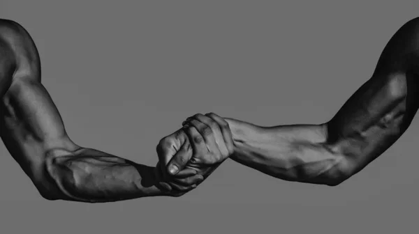 Men hand, support. Close up help hand, isolated. Two hands of muscular men . Rescue, helping gesture or hands. Strong hold. Muscular men arms