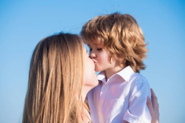 Mothers love. Closeup portrait of mother and child kissing. Mother hugging and embracing son. Mothers day, love family. Mother and child with tenderness. Mothers kiss child, cuddle warm relationships