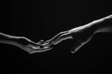 Hands at the time of rescue. Friendly handshake, friends greeting, teamwork, friendship. Rescue, helping gesture or hands. Romantic touch with fingers, love
