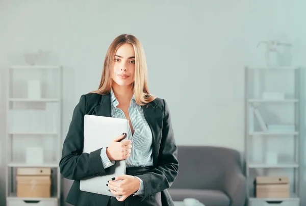 stock image Young businesslady at workplace in the office. Portrait of secretary woman in formal wear working on project at modern office