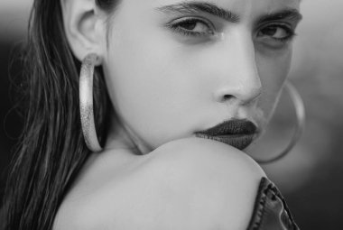 Sensual portrait of young woman in studio. Beautiful girl fashion model