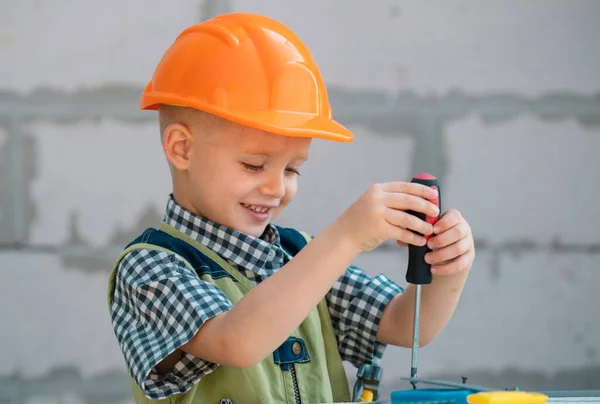 Little Boy Holding Screwdriver Kid Twists Bolt Screwdriver Little Repairman — Stock Photo, Image