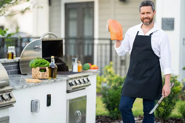 Man Chef Apron Hold Salmon Fish Barbecue Grill Male Cook — Stock Photo, Image